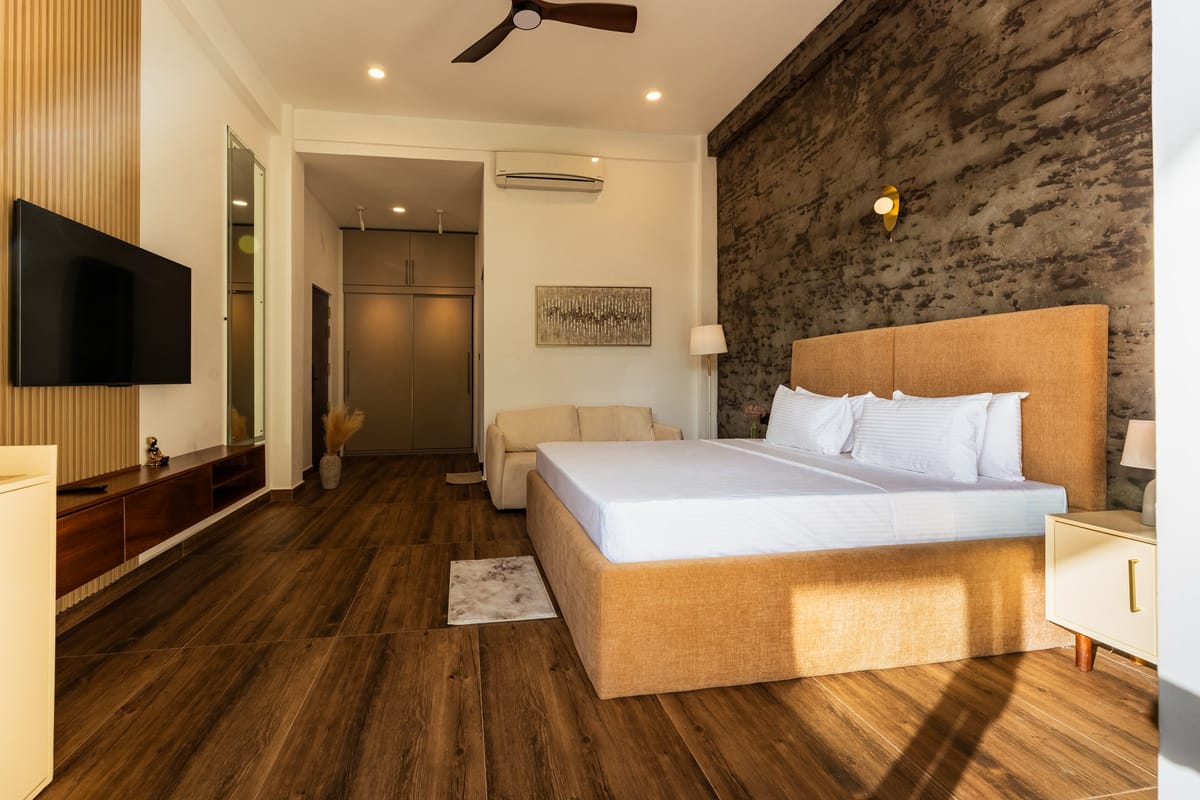 Pool View Room 2, stone wall and wooden floor