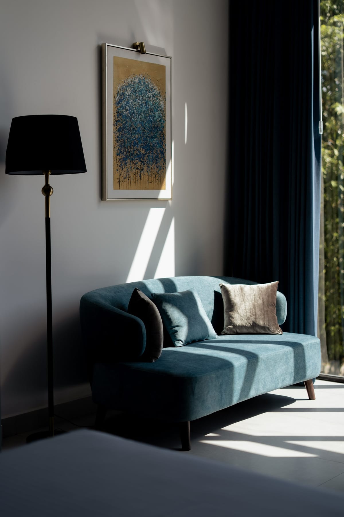 River View Room 1, teal armchair by the window