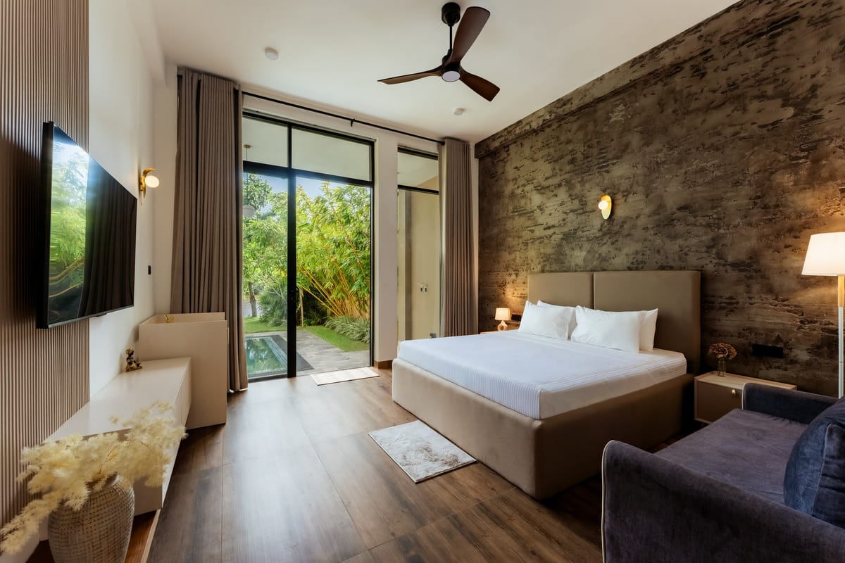Pool View Room 1, double bed and window onto the garden