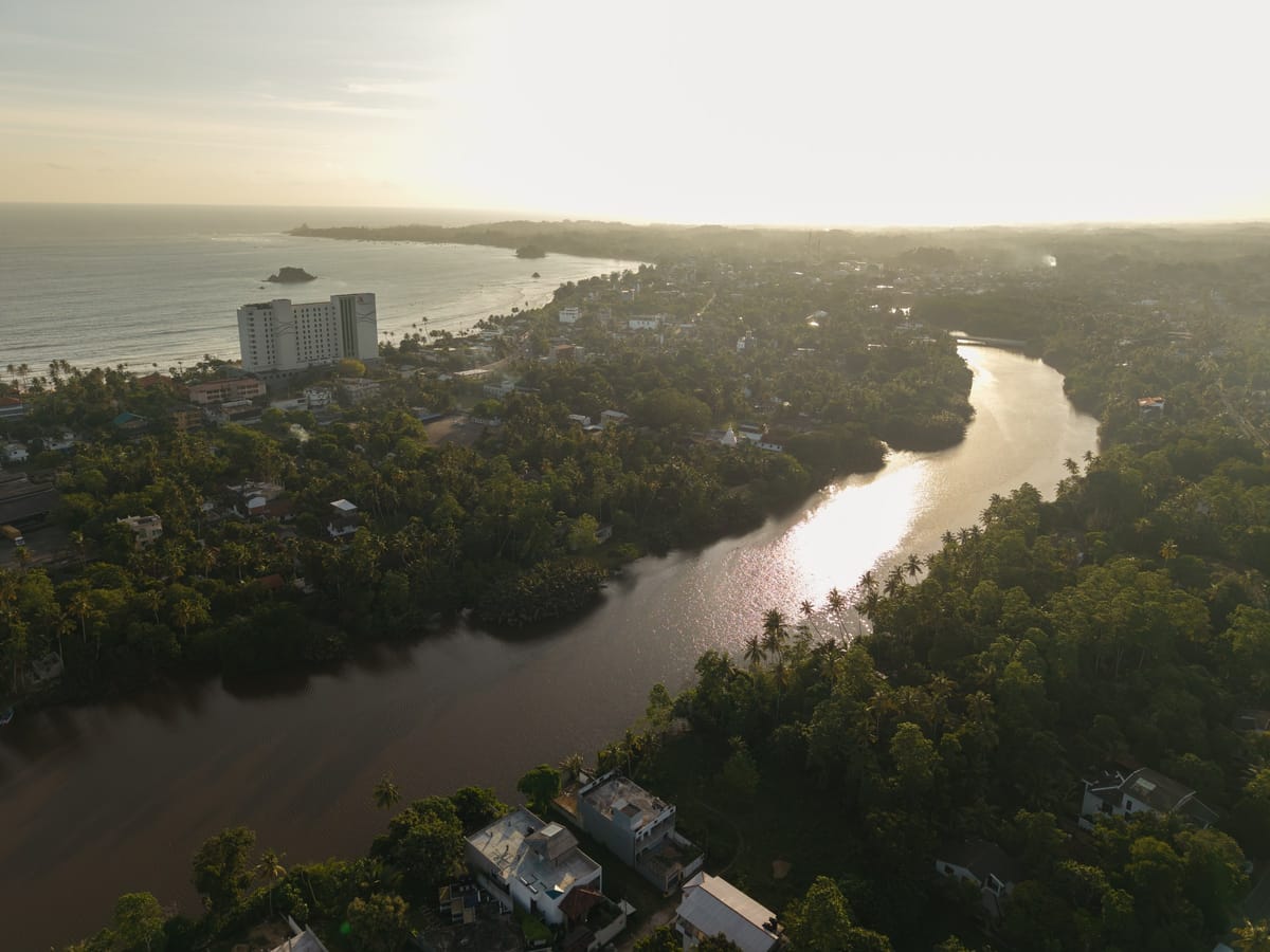 The river winding down to Weligama Bay at sunset