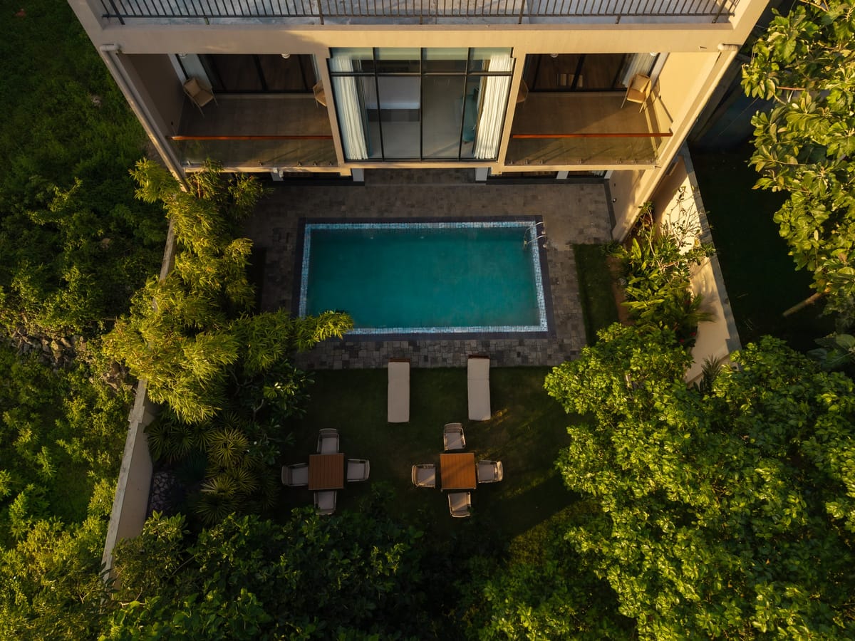 The pool, terrace and garden seen from above